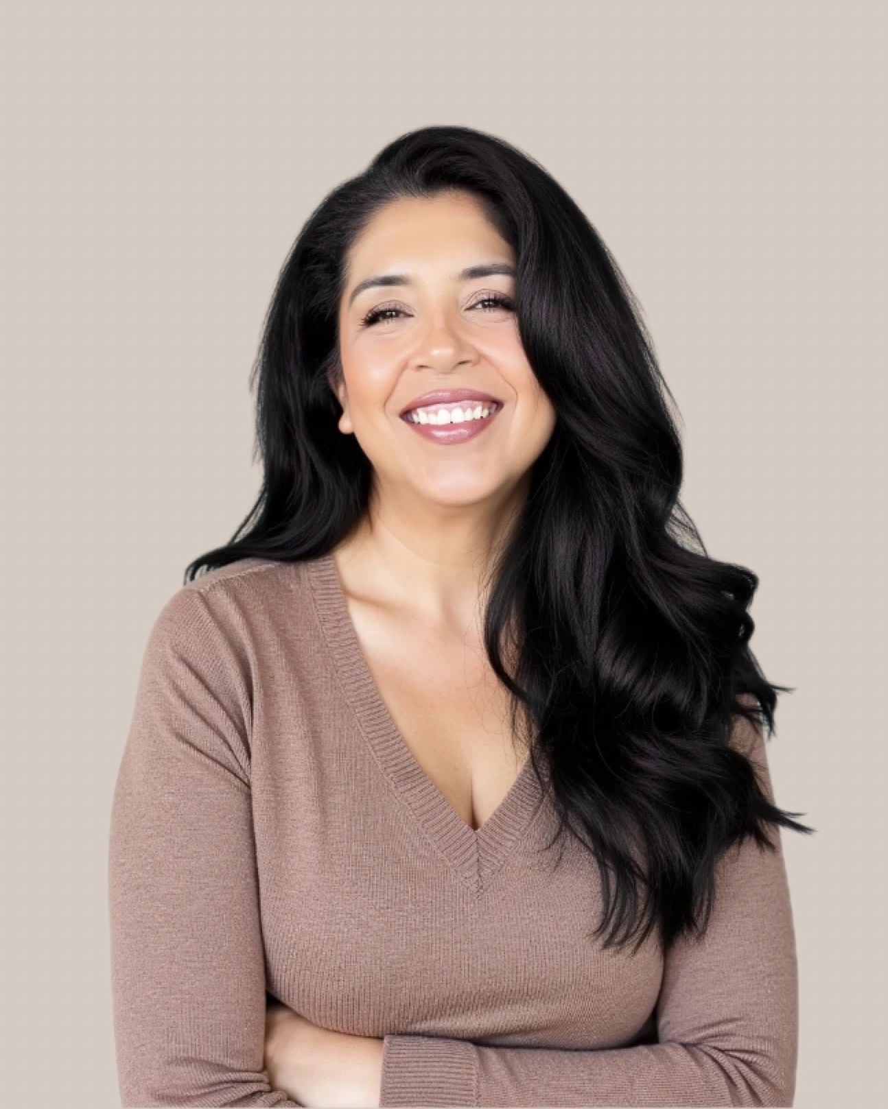 Maria Rosero smiling with arms folded